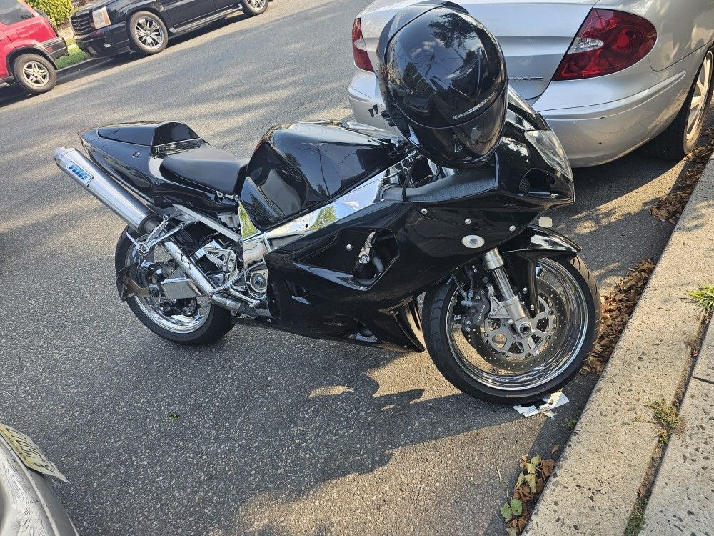 01 Suzuki GSX-R 750. It is Black and Chrome.