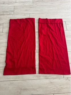 Two red pillow cases 39’ long