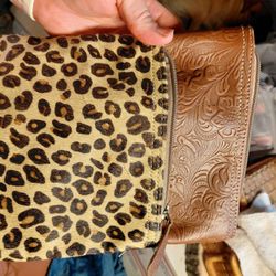 Myra Bag cowhide and leather crossbody purse with a leopard print hair-on hide front pouch and a brown embossed leather main compartment. 