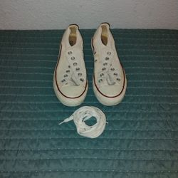 A Pair Of Converse Tennis Shoes 