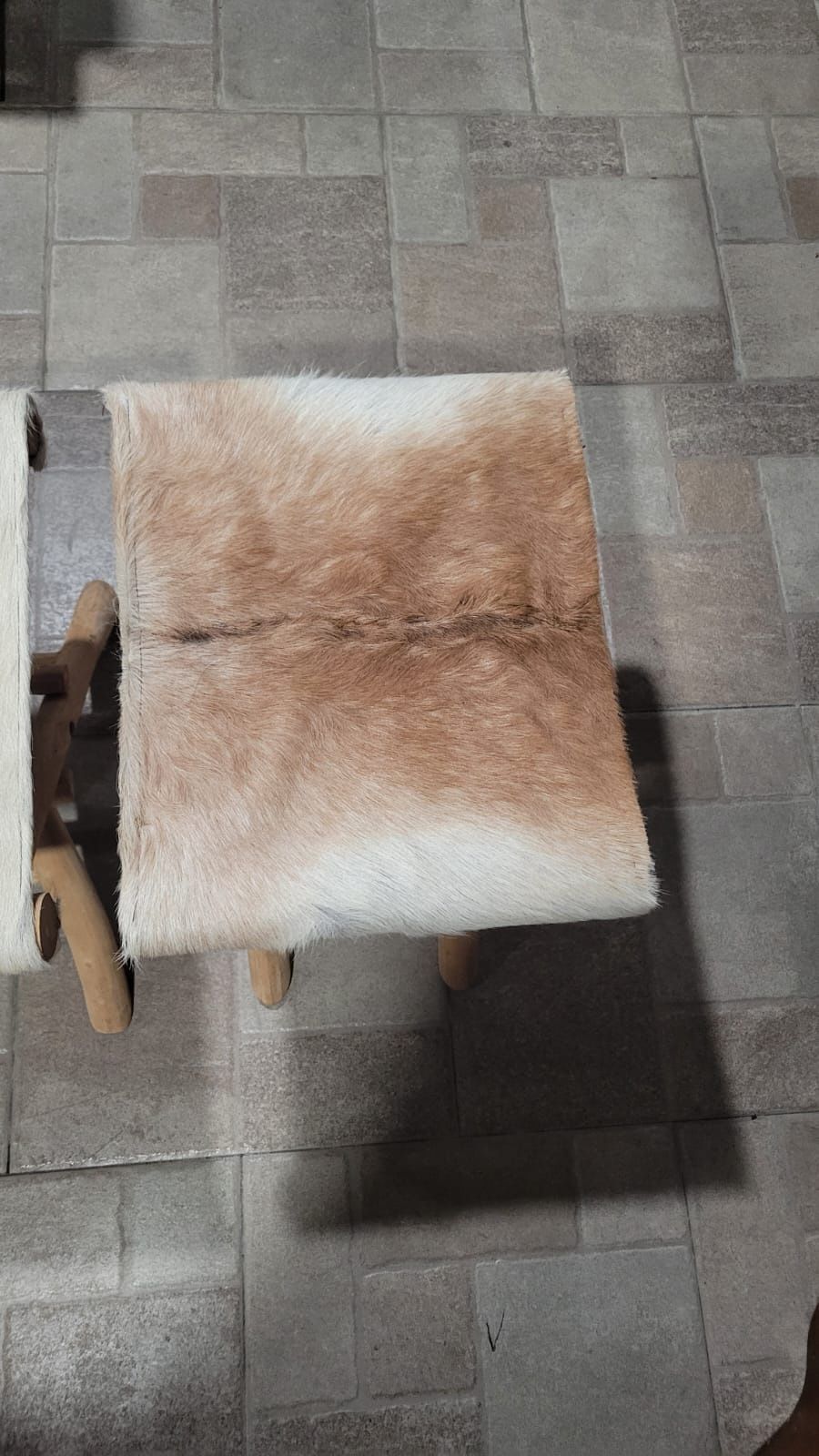 2 cowhide folding stools 