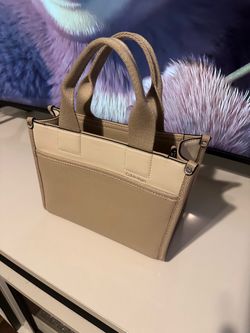Calvin Klein women's Elements line satchel with a top  zip closure.