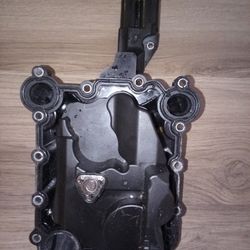 Audi crankcase vent valve, also known as an oil separator or PCV (Positive Crankcase Ventilation) valve. 