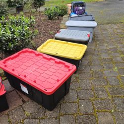 Tubs of clothes, shoes, purses