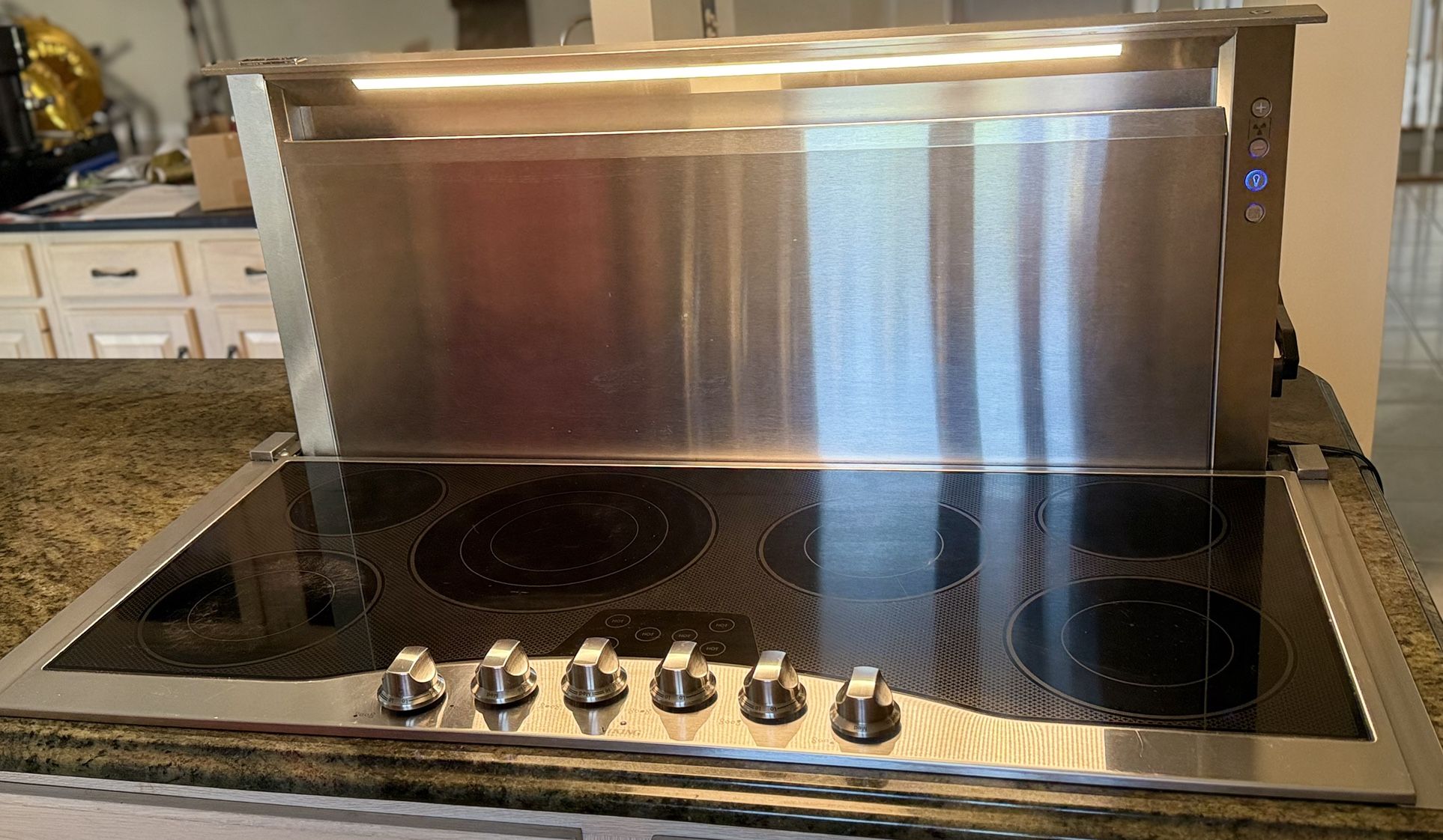 Viking stainless steel electric cooktop and Viking rear downdraft