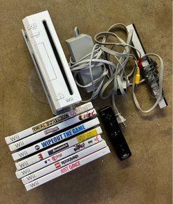 Nintendo Wii Console bundle white with cords, controller, and 7 games