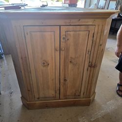 Solid Wood Two-Door Corner Cabinet – $60