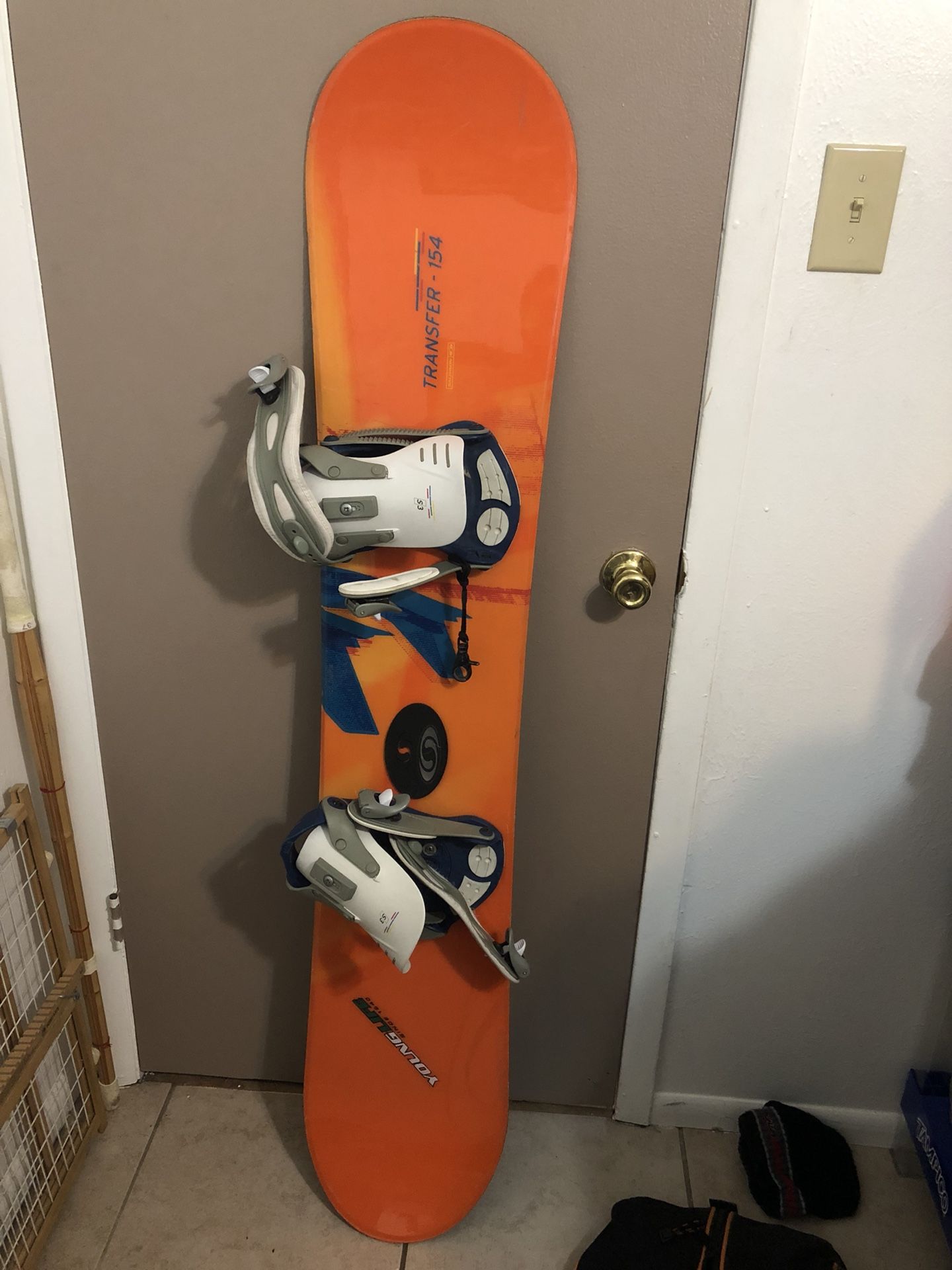 Snowboard with boots bindings and bag
