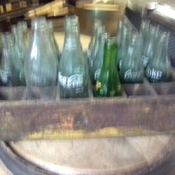 Old Wooden Coca-Cola Crate With Some Bottles 