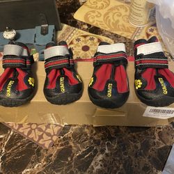 Two sets of dog shoes size 5 in black size 3 in red $15 a set