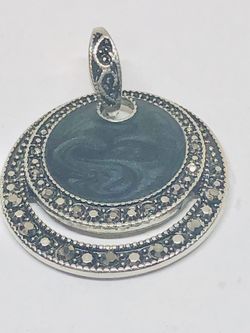 Silver tone pendant with faux green stone and marcasites