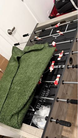 Foosball table and grass