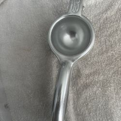 Durable metal citrus juicer for easy squeezing.