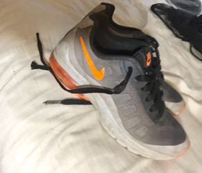 Size 3.5 boys black and orange Nikes