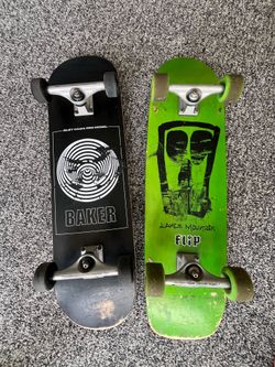 Two complete skateboards, baker and lance mountain.
