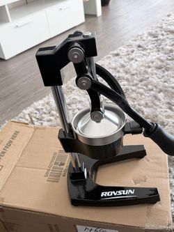 ROVSUN commercial grade manual cast iron citrus juicer in black with a stainless steel press bowl.