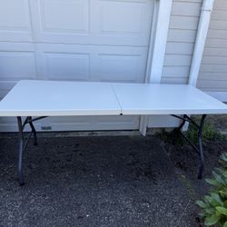 PENDING PICKUP - 6 foot folding tables with handles (2 available)