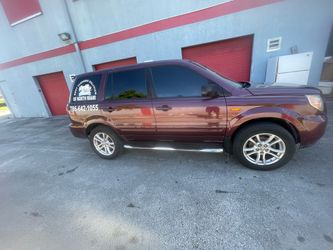Honda Pilot SUV Burgundy with Running Boards