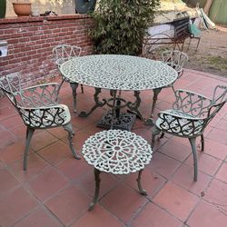 Two Rod Iron Tables and 4 chairs