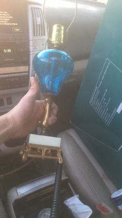 Vintage combat coin drop blue glass lamp sells for around $325