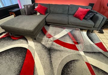 Sectional sofa with table and rug