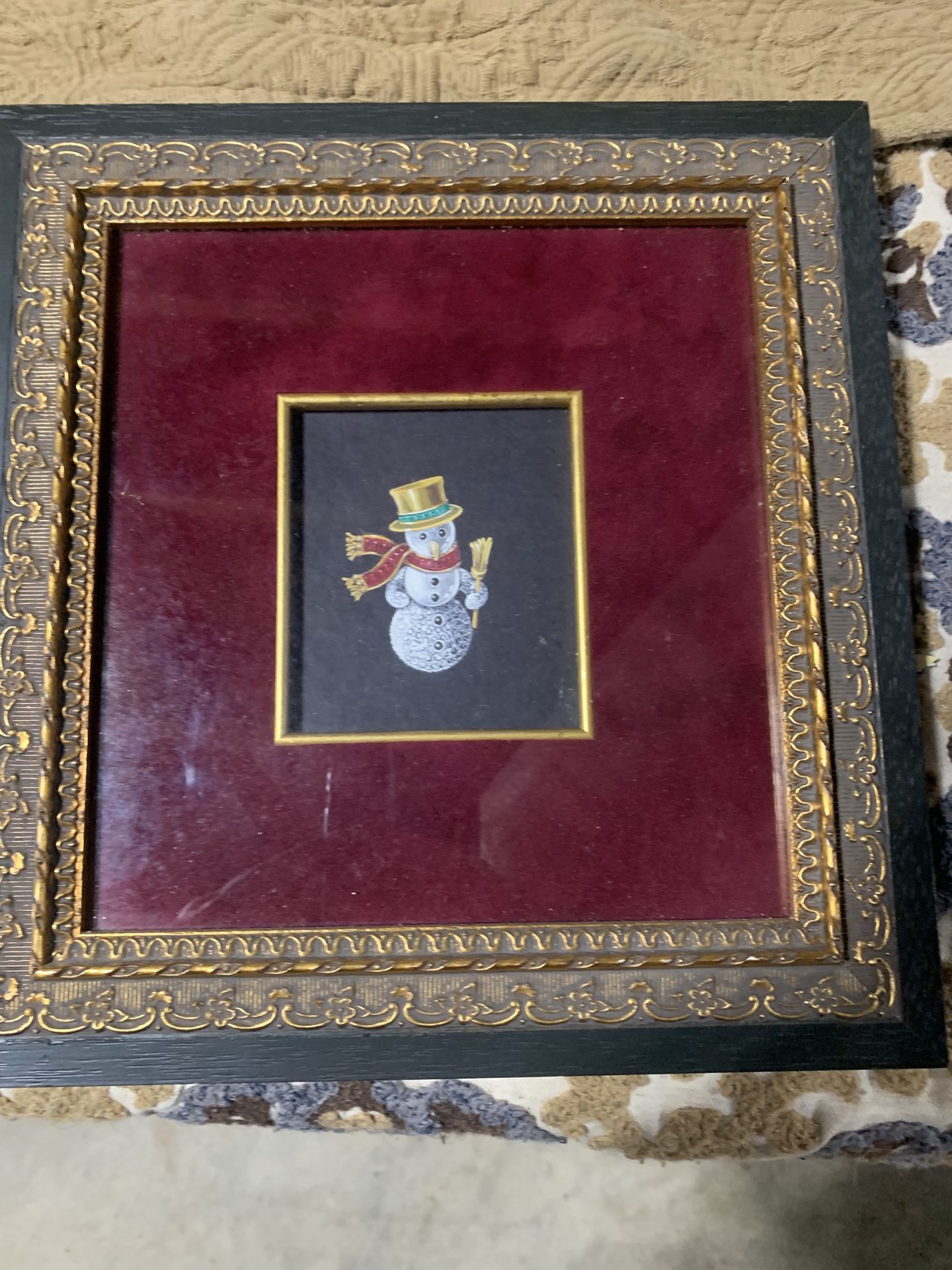 Framed decorative art featuring a snowman with vintage Frame