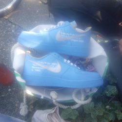 These are the Nike Air Force Size 11 Low Off-White MCA University Blue sneakers. 