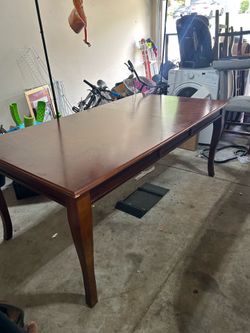 Wooden dining table with 4 chairs