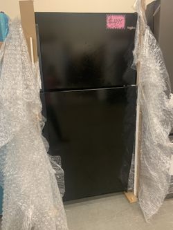 New Whirlpool 33in wide top freezer refrigerator with 1 year manufacturer warranty