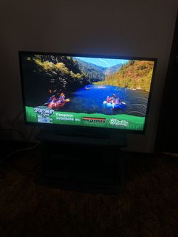 32” RCA FLAT SCREEN TV WITH STAND TV