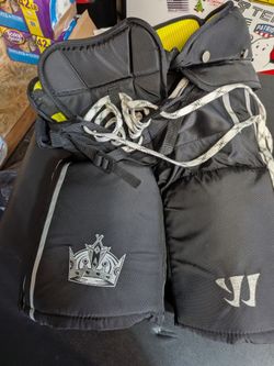 Bulk lot hockey pants, gloves, and skates