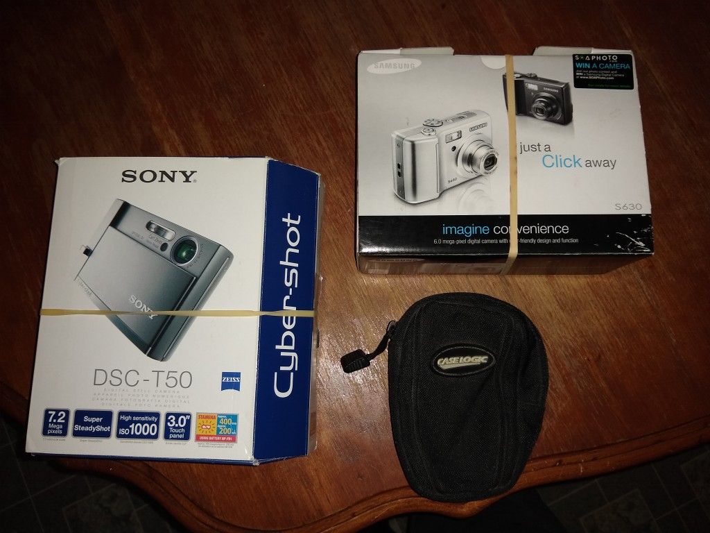 2 digital cameras for trade