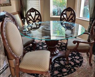 Round Glass Dining Table with 5 Ornate Carved Wood Chairs