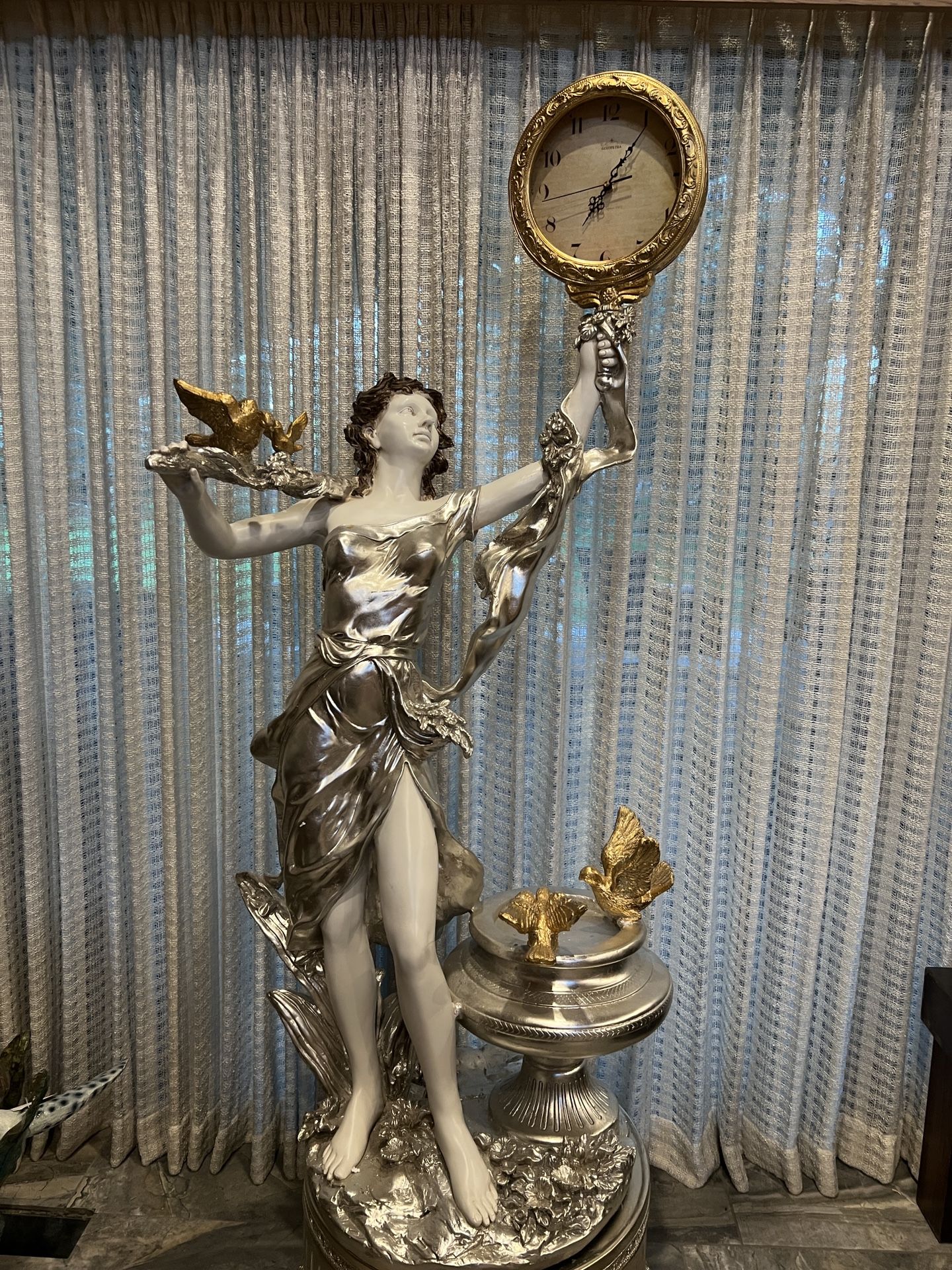 Woman With Clock Statue