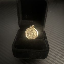 14 K GOLD AZTEC CALENDAR PENDANT