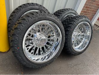 NEW 22x12 AXE FORGED wheels with floating caps wrapped in 33x12.50r22RBP tires. They are 8 lug 8x180 bolt pattern