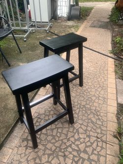 Two black bar stools 2 ft tall