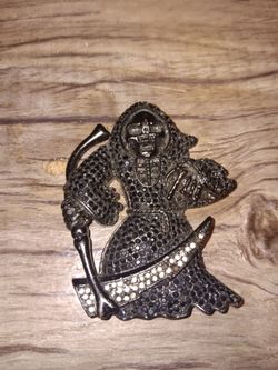 Elmo pendent and broken grim reaper pendent