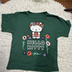 Hello Kitty green floral print short sleeve top Medium on tag  Smoke free home  Flaws as seen in the last picture (little stain)