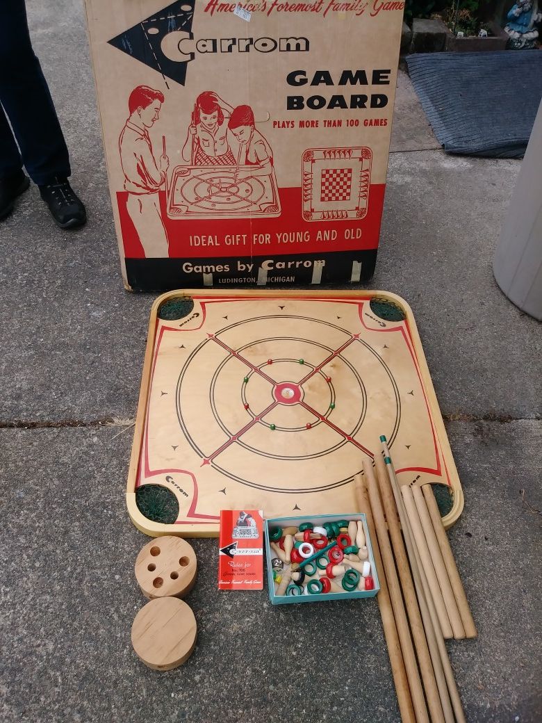 Likr new 1970's Carrom game board. Play over 100 games. All orignal piece included, Box, and player manual. Well taken care of, well stored. 150$