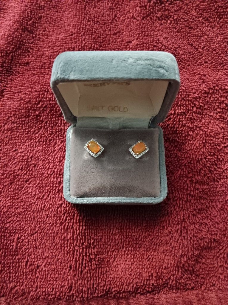 Fire opal and diamond fashion earrings.