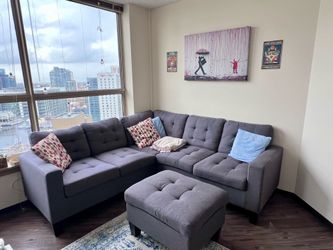 Modern Gray Sectional Sofa with Ottoman – $500