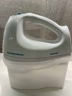 Baking hand mixer, trays, and parchment paper