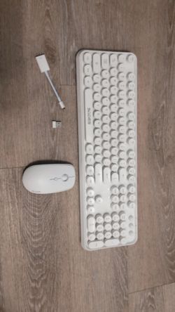 white keyboard with mouse, usb, and lightning to usb adapter