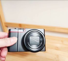 Lumix DMC-ZS100 4k camera with lens