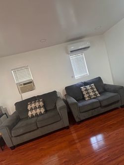 2 Ashley’s furniture couches (2 seater love couches)