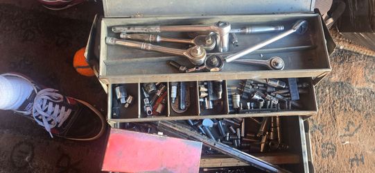 Vintage tool box full of sockets and drivers