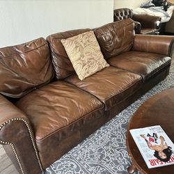 Beautiful brown leather couch and sitting chair!