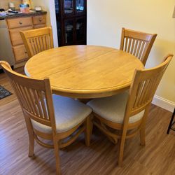 Round Table with Self Stored Leaf And 4 Chairs