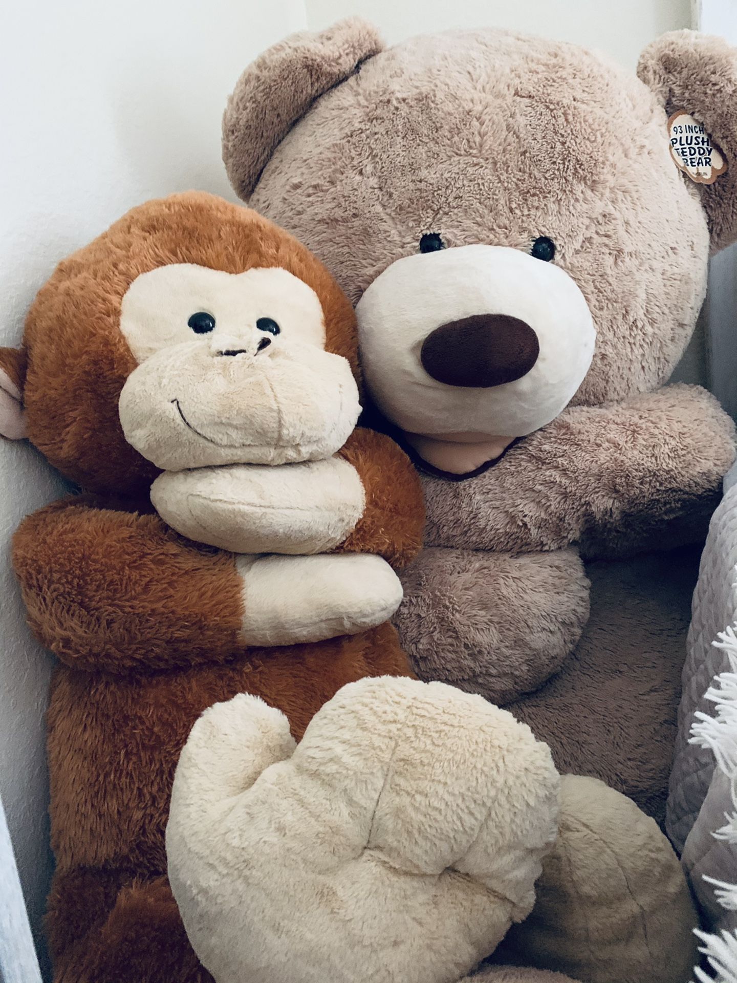 Huge teddy bear and monkey